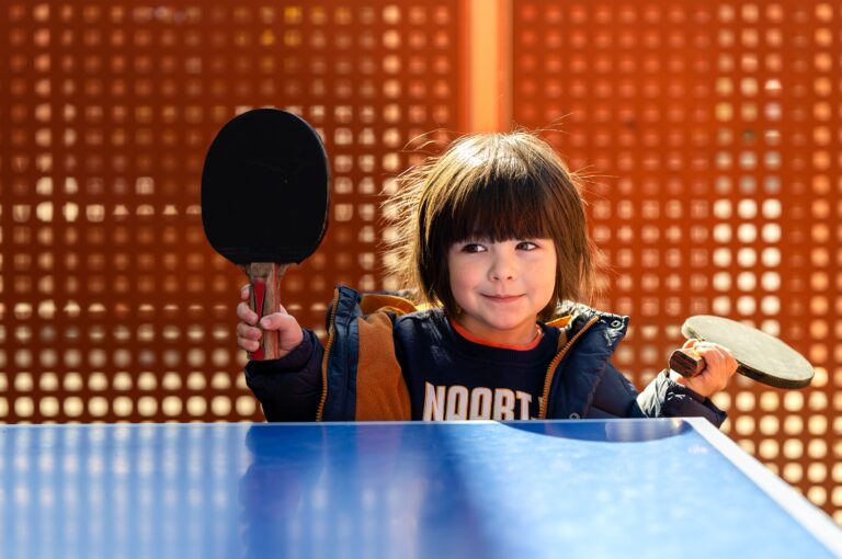 cute-little-toddler-boy-playing-ping-pong-outdoors-2025-02-12-00-38-28-utc