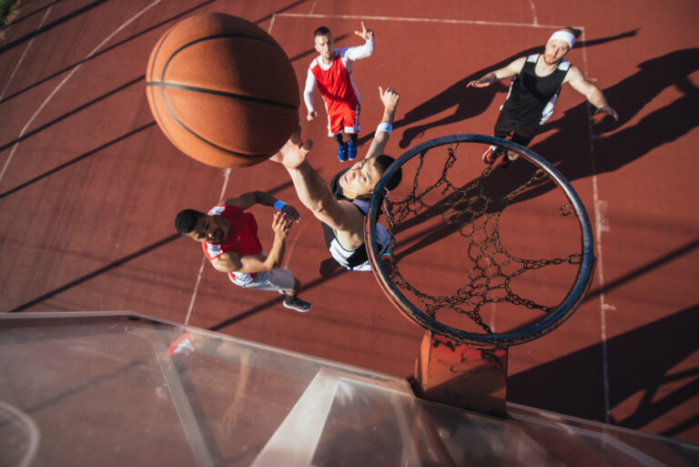 High angle shot of a basketball player scoring a point.